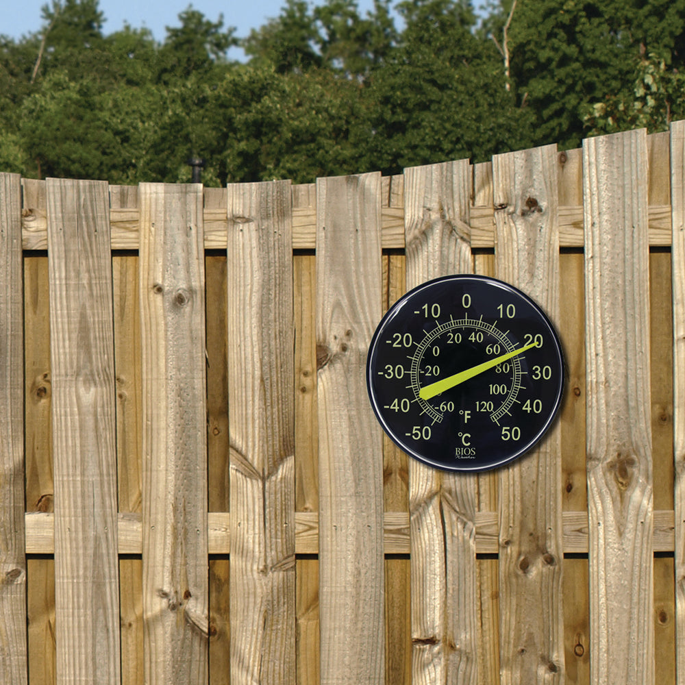 TR608 12" / 30 cm Neon Dial Weather Thermometer on fence